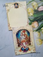 Front-Photo-of-Cream-and-Blue-Indian-Bride-and-Groom-with-Ganesha-Royal-invitation-card-1.jpg