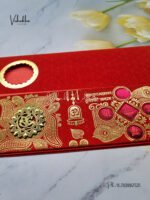 Side-Angle-Of-Red-Piano-style-paper-Scroll-with-Ganesh-Marriage-card-1.jpg
