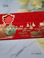 Side-Angle-Of-Red-Piano-style-paper-Scroll-with-Kalash-Ganesh-Shadi-card-1.jpg
