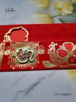 Side-Angle-Of-Red-Piano-style-paper-Scroll-with-Om-Ganesh-Invitation-card-1.jpg