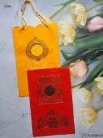 Front-Photo-of-Peacock-Ganesh-Ji-Hindu-Carry-Bag-Red-And-Yellow-Colored-wedding-invitation-Cards-GS-7-1.webp